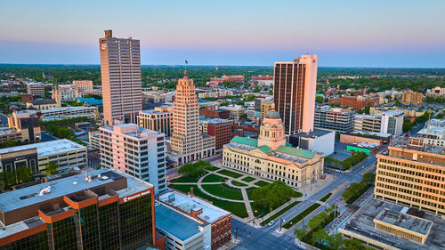 Buildings in city against sky