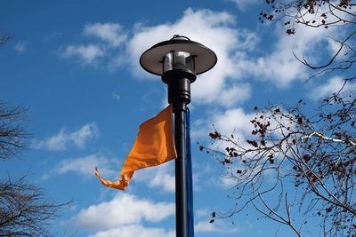 Low angle view of street light against sky