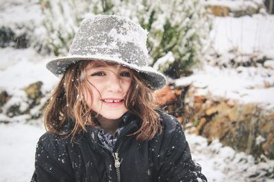 Close-up portrait of girl wearing hat during winter