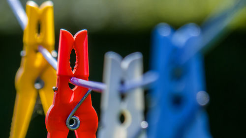 Close-up of clothespins on clothesline