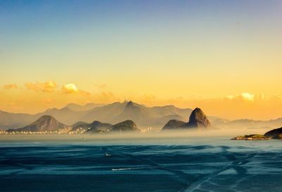 Scenic view of sea against clear sky during sunset