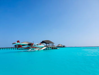 Scenic view of sea against clear blue sky