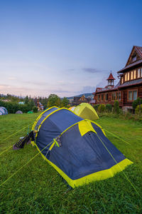 Colorful tents camping concept during holidays in summer on zakopane mountain old house, tatra 