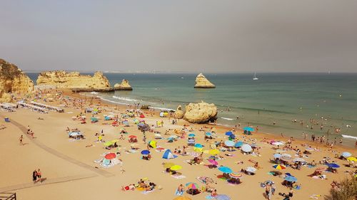 High angle view of people on beach against sky