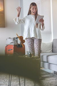 Portrait of young woman using mobile phone