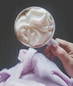 Close-up of woman holding coffee cup