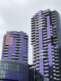 Low angle view of modern buildings against sky