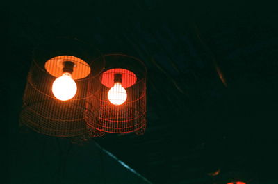 Low angle view of illuminated lantern at night