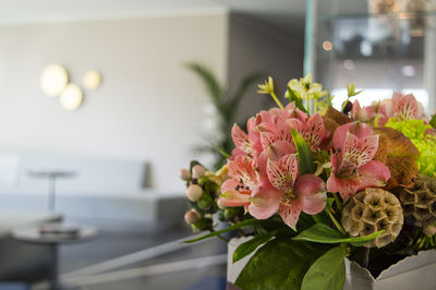 Close-up of flower vase on table at home