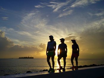 Silhouette of woman standing on beach