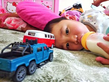 Portrait of cute boy with toy car