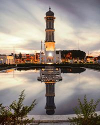 Reflection of illuminated buildings in water