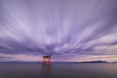 Long exposure shot of shirahige shrine torii gate at sunset at lake biwa, shiga prefecture, japan