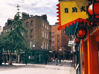 Chinese street amidst buildings in city