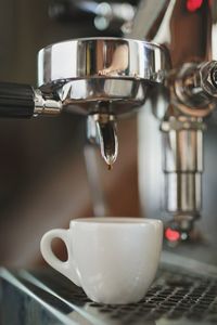 Close-up of cup on coffee maker