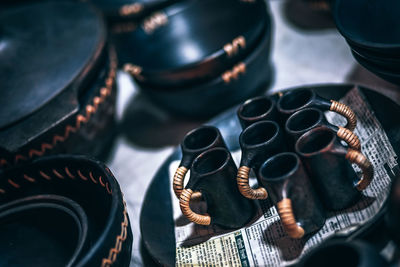 High angle view of ceramic containers on table