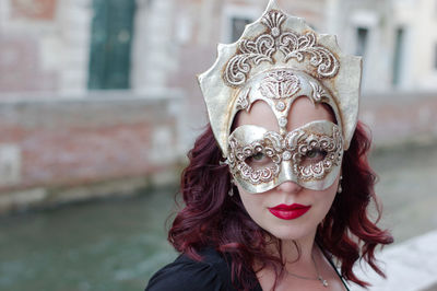 Close-up of woman wearing venetian mask