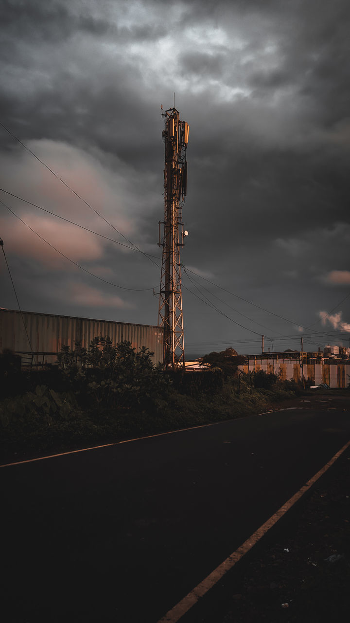 COMMUNICATIONS TOWER ON LAND AGAINST SKY