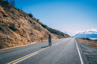 Road amidst mountains against sky