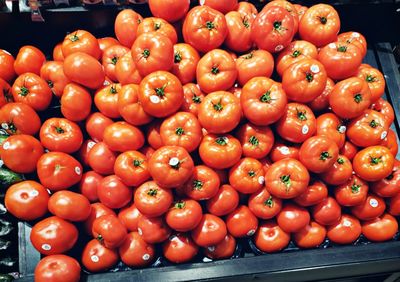 High angle view of tomatoes for sale at market stall