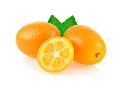 Close-up of oranges against white background