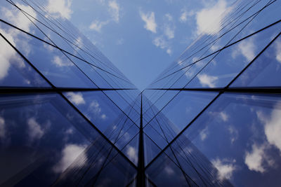 Low angle view of bridge against cloudy sky