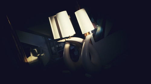 Low angle view of illuminated lamp