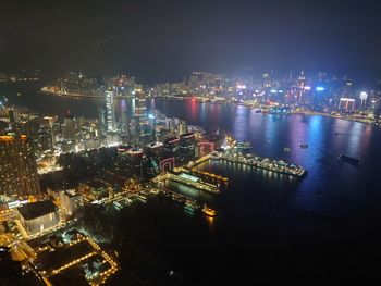 High angle view of illuminated buildings in city at night