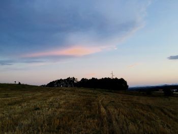 Scenic view of field against sky during sunset