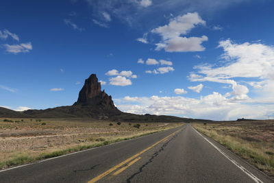 Road amidst landscape against sky