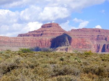 Rock formations on landscape against sky