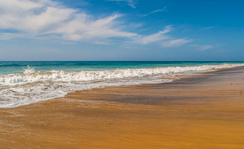 Scenic view of beach against sky