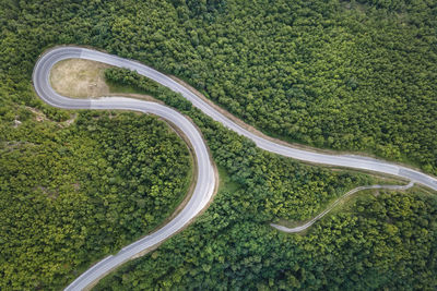 High angle view of road amidst green landscape