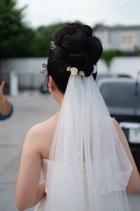 Rear view of woman with umbrella