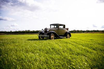 Tractor on field against sky