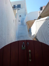 Low angle view of gate against staircase