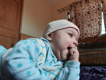 Portrait of cute baby girl at home