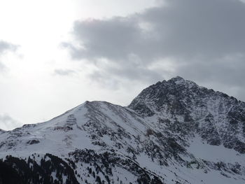 Scenic view of snow covered mountains against sky