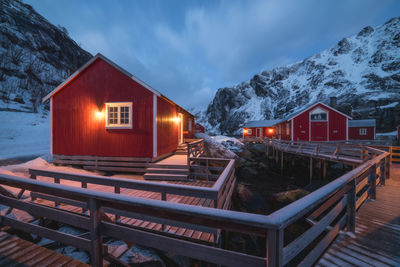 Built structure on snow covered houses against sky