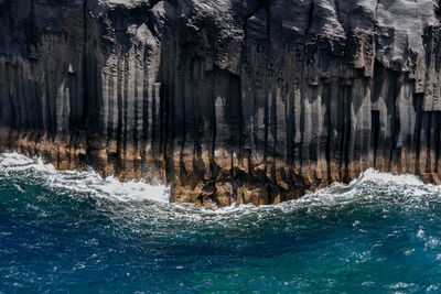 Scenic view of rock formation in sea