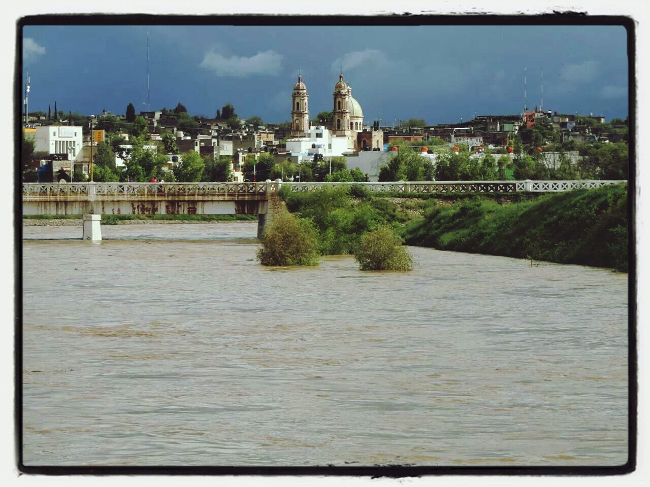 architecture, building exterior, transfer print, built structure, auto post production filter, sky, water, river, tree, waterfront, city, church, house, cloud - sky, residential structure, place of worship, religion, day, cloud, residential building