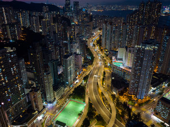 Aerial view of illuminated buildings in city at night