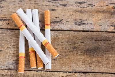 Cigarette roll on old wooden table background