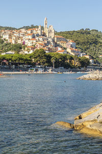  cervo beach with its characteristic rocks and the beautiful town in the background