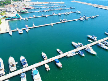 Aerial view of sailboats moored in sea