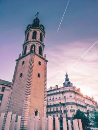 Low angle view of clock tower against sky