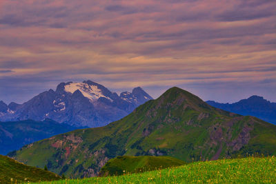 Scenic view of mountain against cloudy sky
