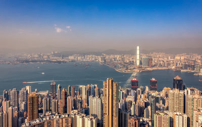 Aerial view of city buildings at waterfront