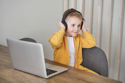 Boy listening music at home