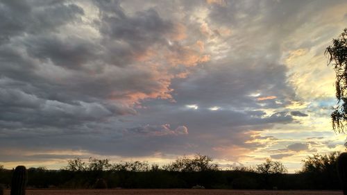 Scenic view of landscape against cloudy sky